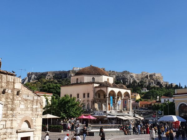 Monastiraki Square with the Acropolis visible for free above the rooftops